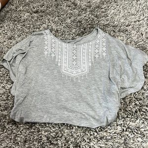 Blouse - gray with white decor on front.  T-shirt white shirt with blue sleeves